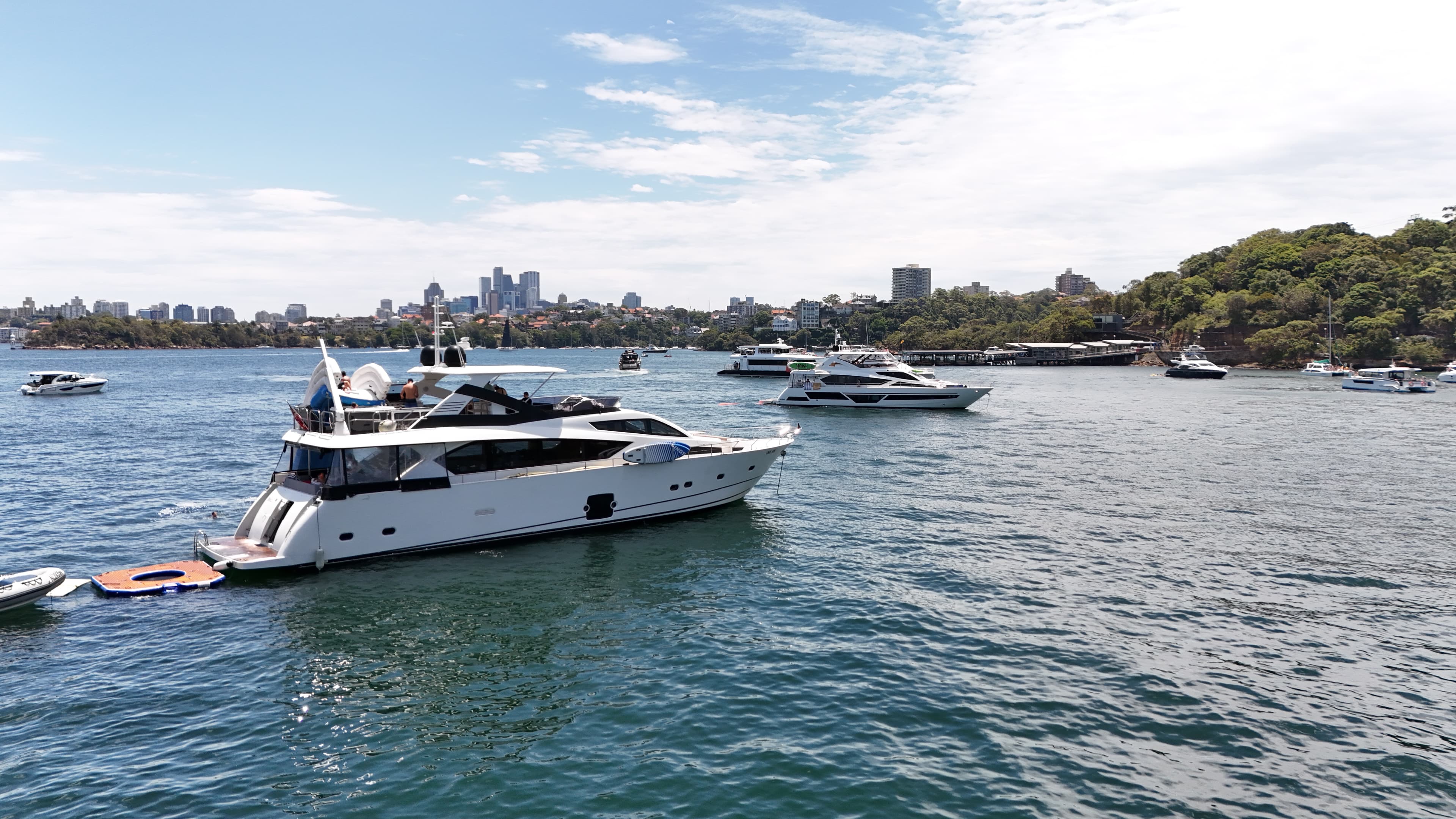 Crew delivering yacht-side